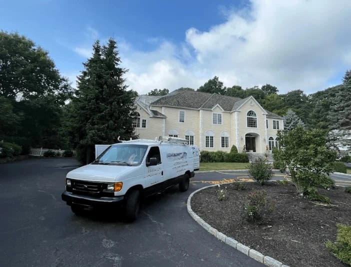 Wickliffe Power Washing technician performing thorough gutter cleaning service in Wickliffe