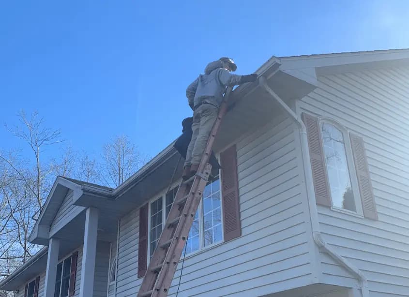 Gutter cleaning and maintenance being performed by Wickliffe Power Washing in Wickliffe